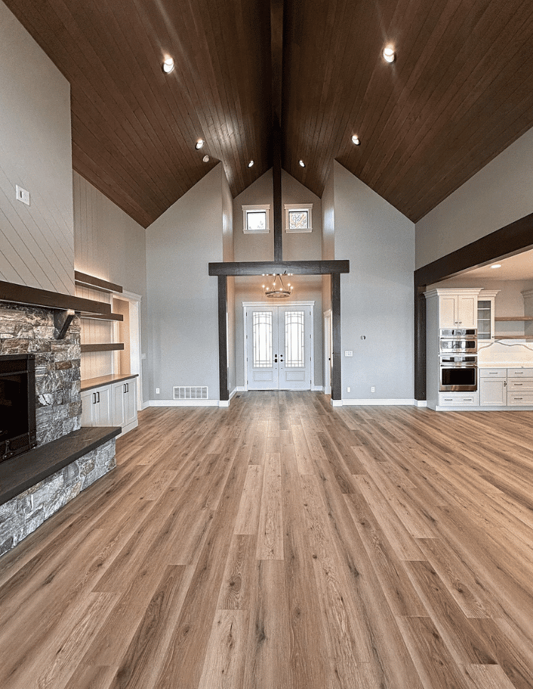 white area rug on hardwood floor with couch and art prints